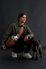 Noah & Paw sling adjustable strap shown for easy length customization and fit.