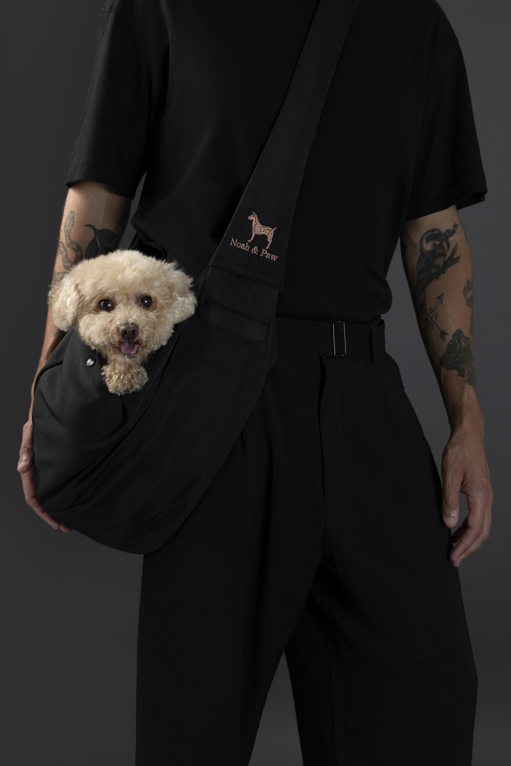 Noah & Paw dog sling carrier with fur-lined interior for cozy on-the-go comfort.