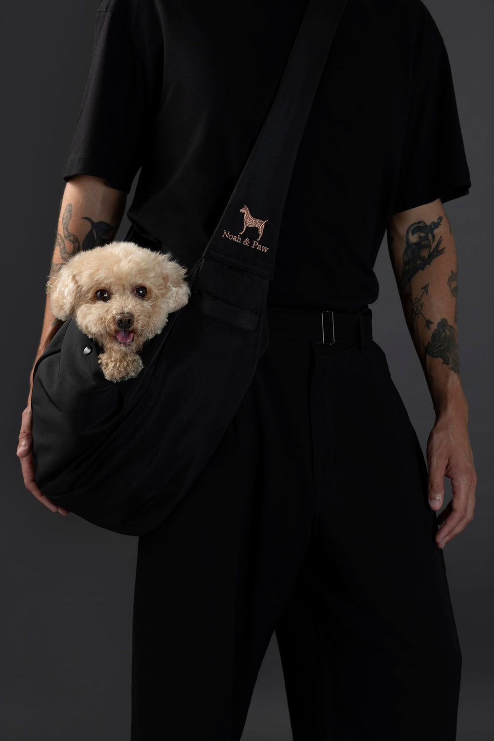 Noah & Paw dog sling carrier with fur-lined interior for cozy on-the-go comfort.