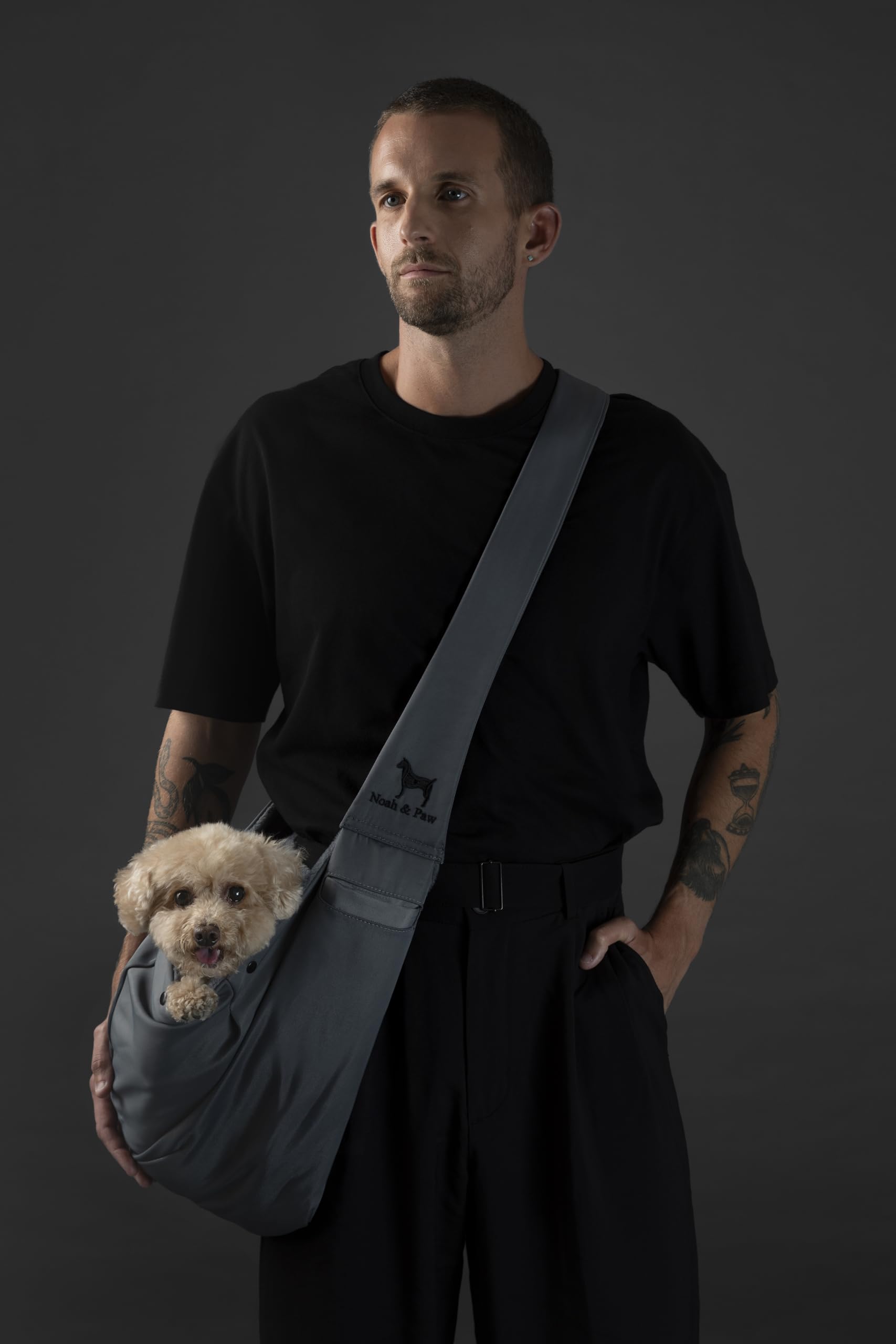 Noah & Paw dog sling carrier adjustable strap close-up for customized fit during long walks.
