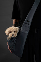 Noah & Paw dog sling carrier safety features close-up showing secure belt and snap.