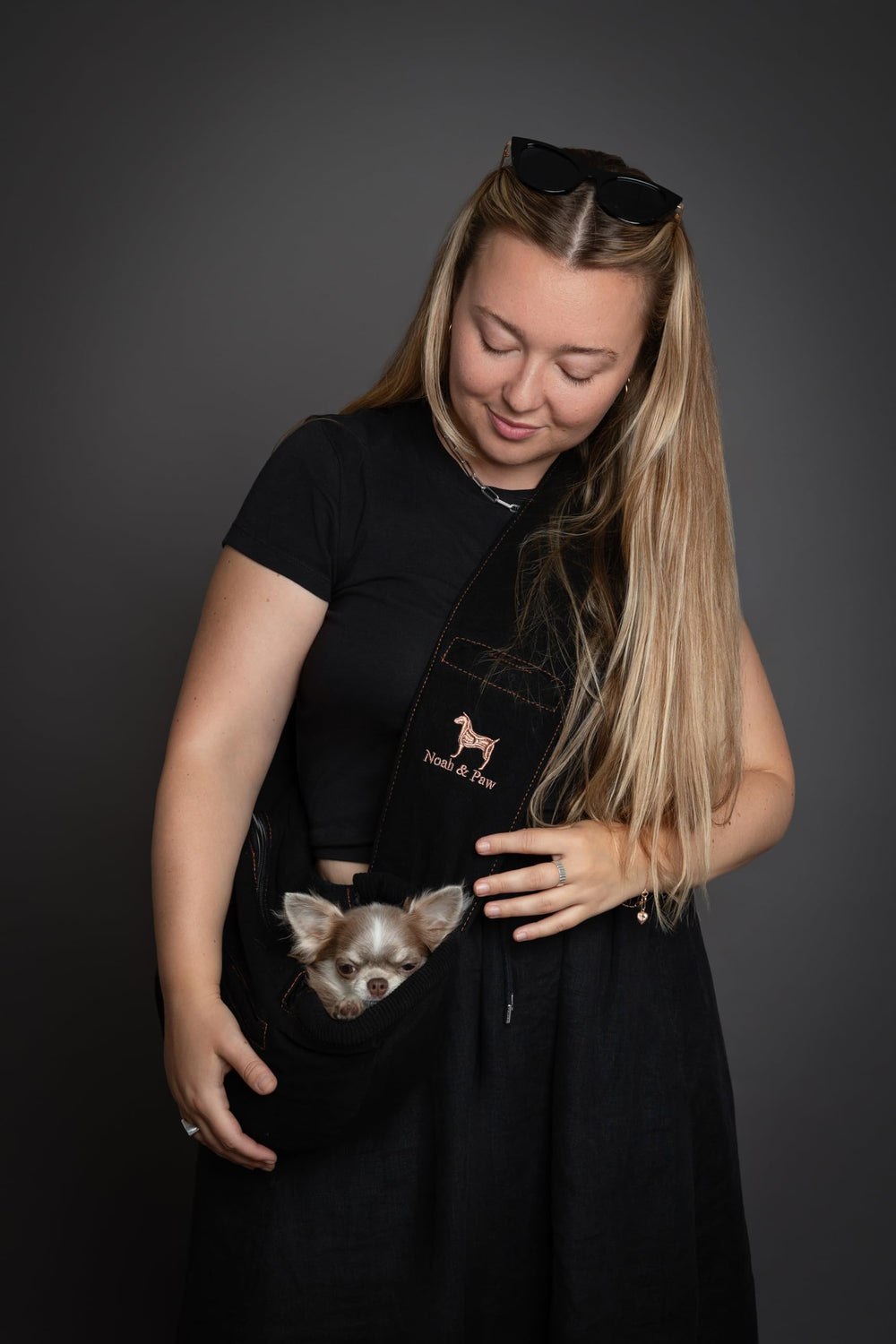 Noah & Paw dog sling head strap closure providing secure control during outings.