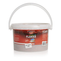 Omega One Super Color Flakes bottle showing color-boosting fish food branding.