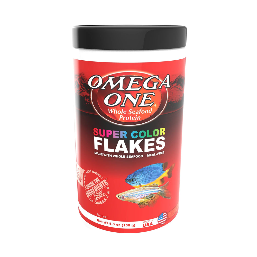 Pouring Omega One Super Color Flakes into an aquarium.