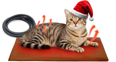Ortri cat heating pad on a plush bed delivering cozy nap warmth