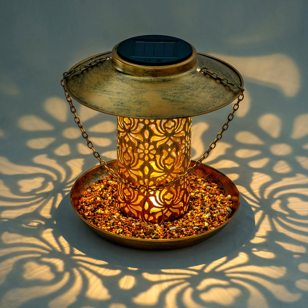 Ottsuls solar bird feeder lantern-night light demonstrates ambient glow for garden wildlife at dusk.