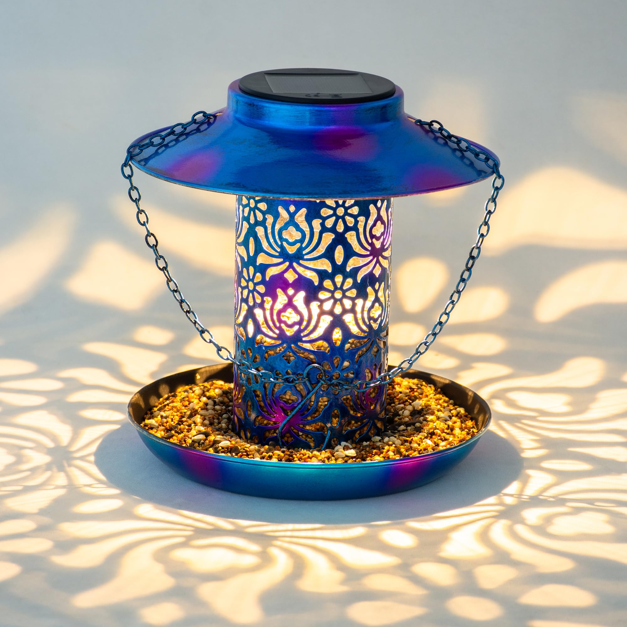 Ottsuls solar lantern feeder blue close-up highlights night glow and seed access