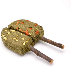 Oxbow Timothy Popsicle aids natural chewing behavior and daily enrichment during playtime.