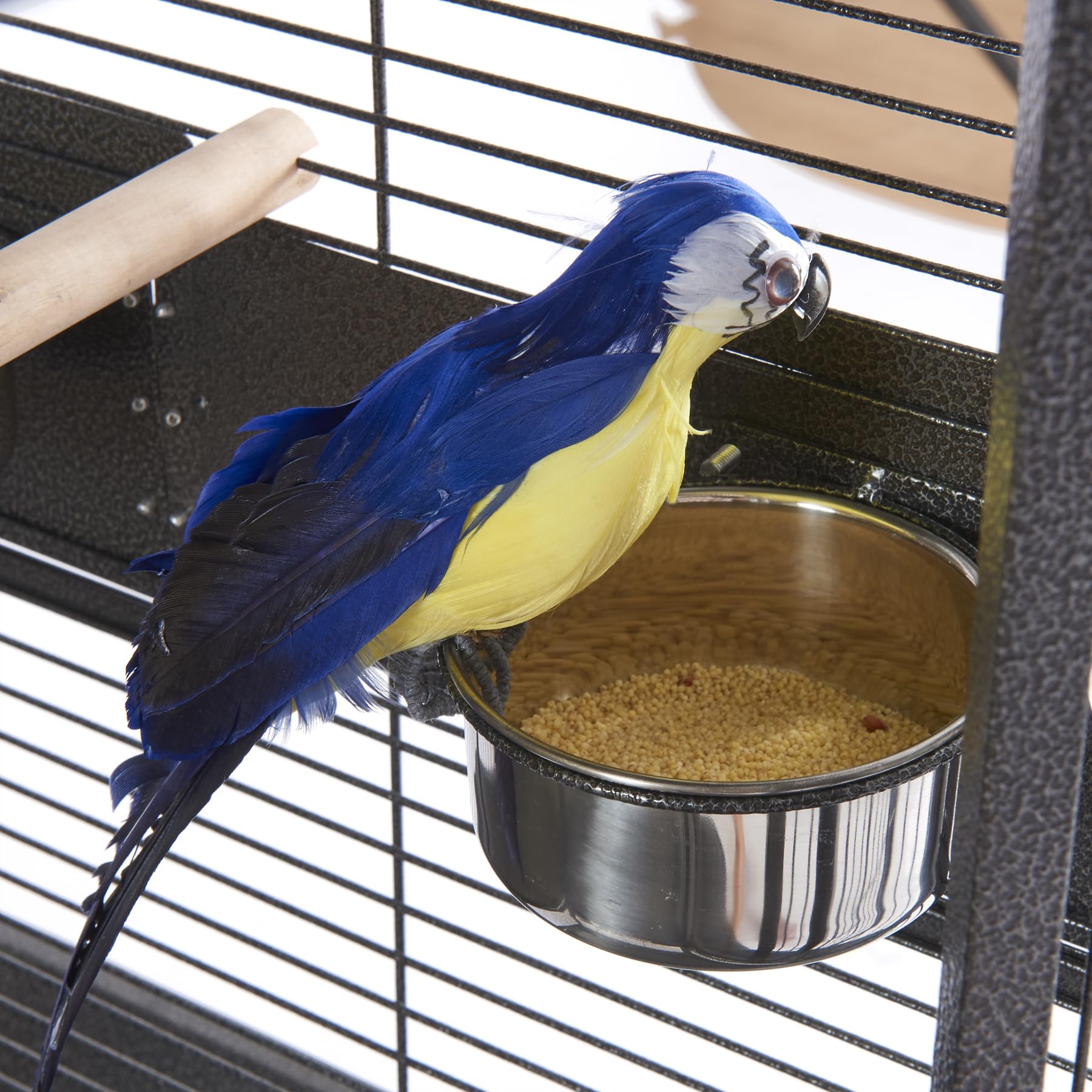 Panana cage accessories include bowls, dowels, and a rope toy for enrichment.