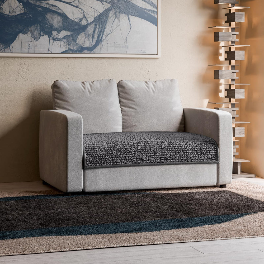 PAULATO BY GA.I.CO. 24x47 blanket size laid over sofa.