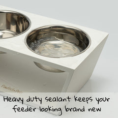 Pawfect Pets elevated dog bowl stand white bowls closeup, stainless steel bowls for easy cleaning.