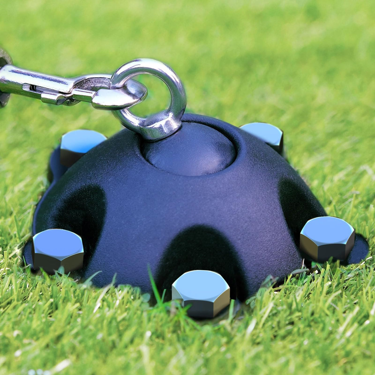 PAWSTATION 360° swivel stake installed in soil for tangle-free play