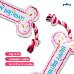 Pawty Dog Toys Birthday Bone Toy pink squeaker close-up boosts playtime.