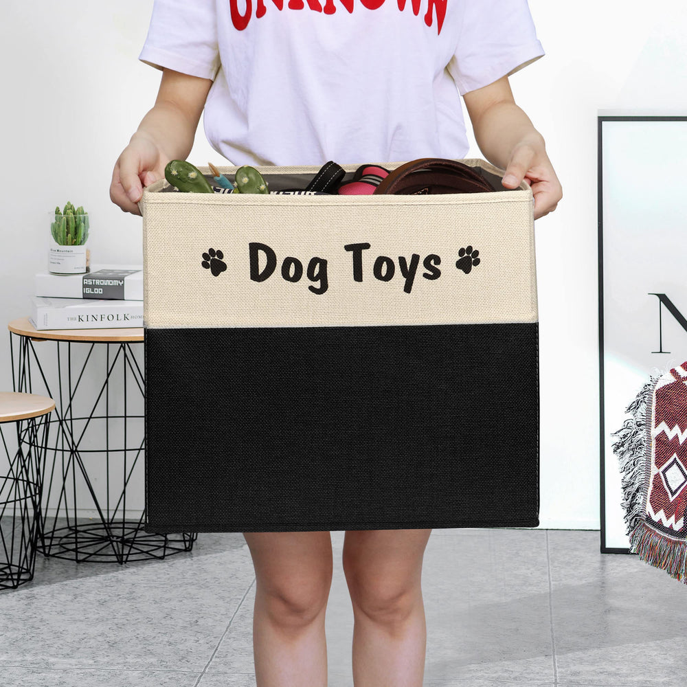 PET ARTIST black dog toy basket folded for compact storage in living room.