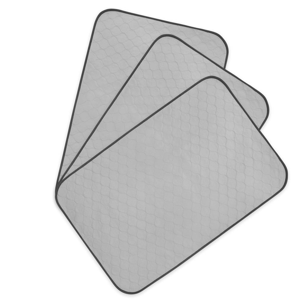 Pet Magasin training pads folded show compact reusable moisture protection for crates.