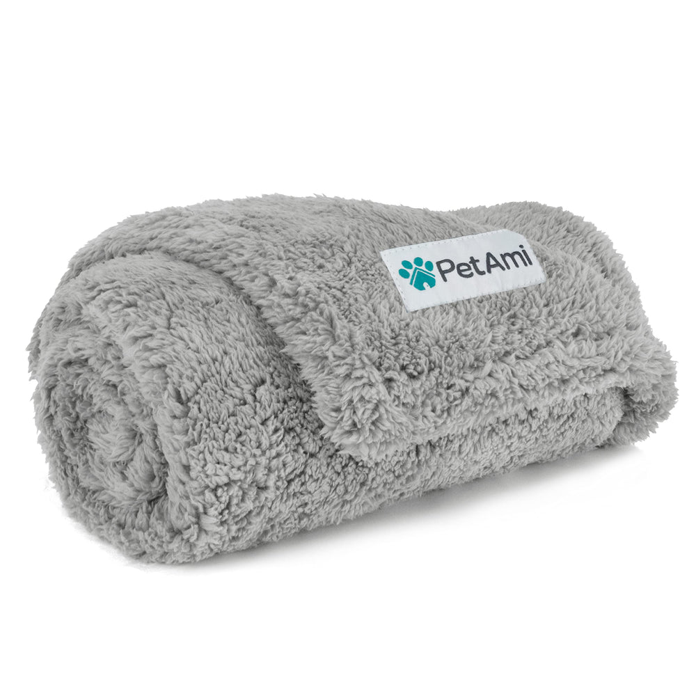 PetAmi fluffy waterproof dog blanket on a sofa protects furniture from spills.