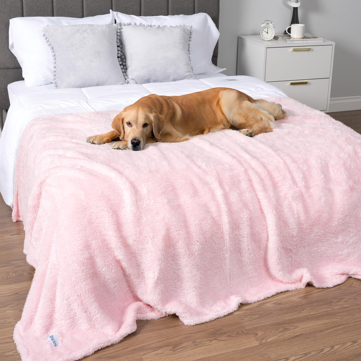 PetAmi pink fluffy blanket 60x80 on bed provides warm coverage.