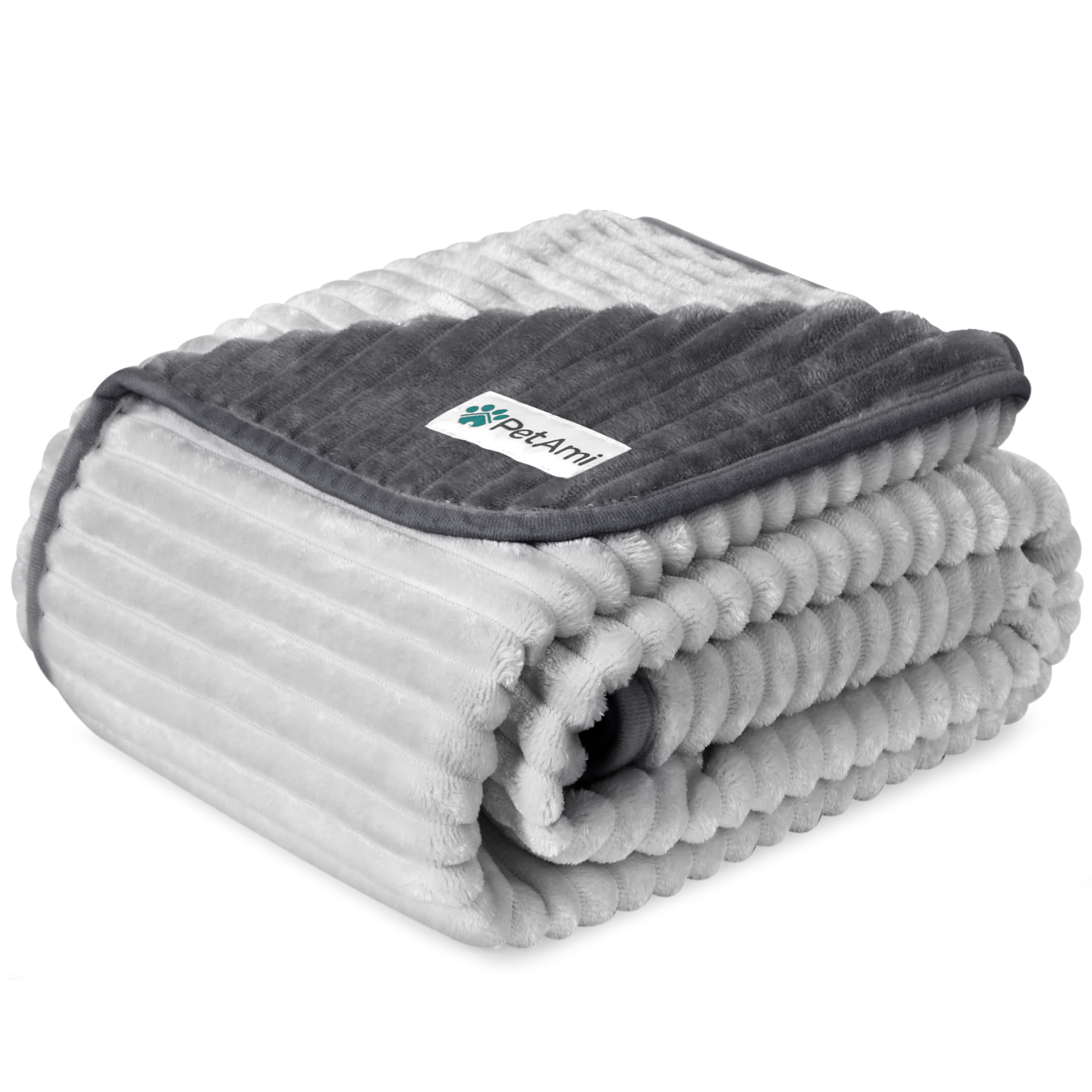 PetAmi waterproof dog blanket on a sofa protects furniture from spills.