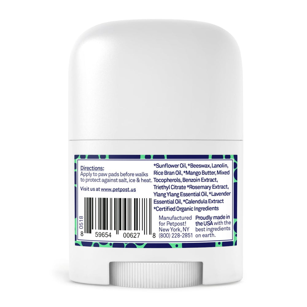 Petpost paw protection balm on paw demonstrates easy, quick application for on-the-go protection.