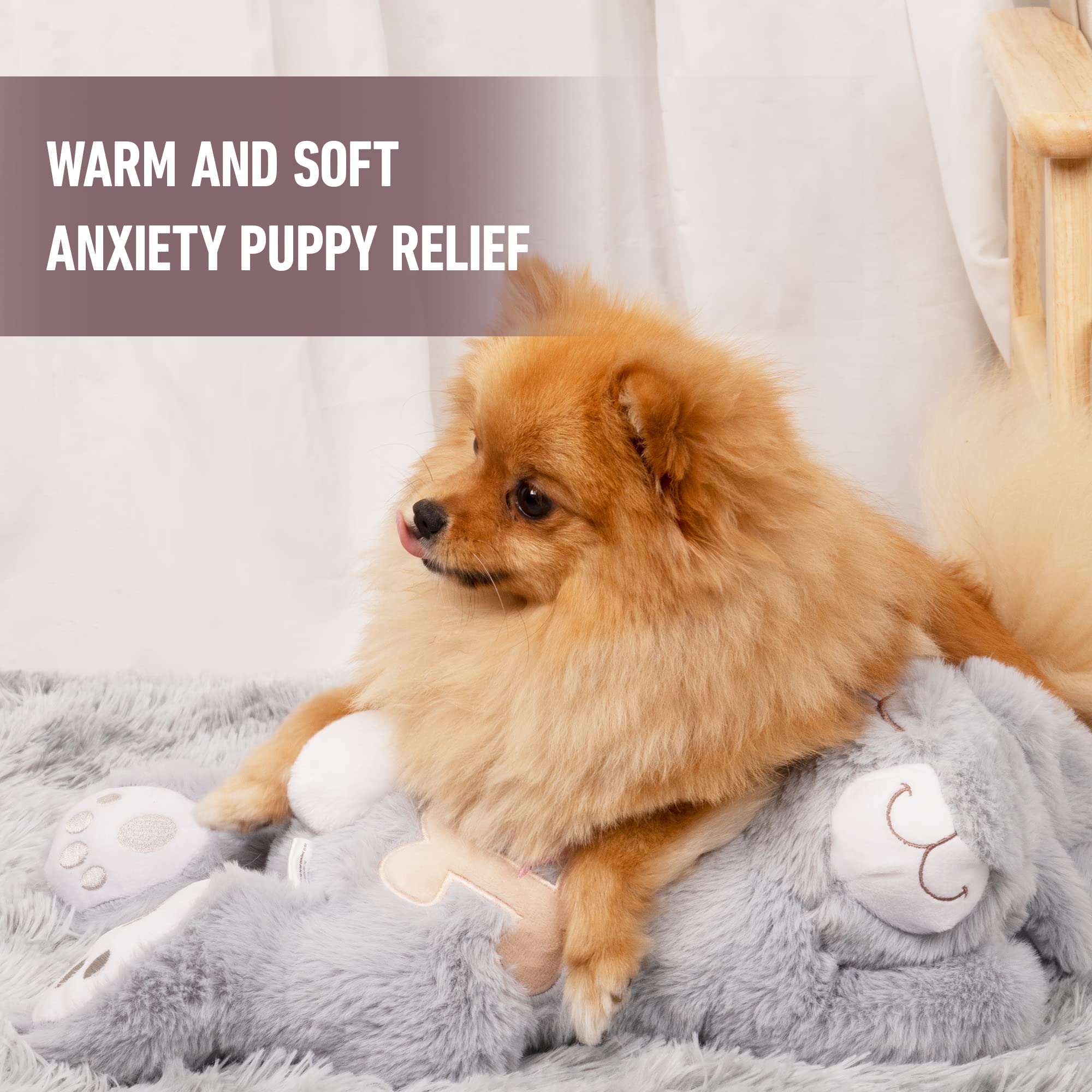 PetPrime puppy relaxing with heartbeat toy for soothing sleep