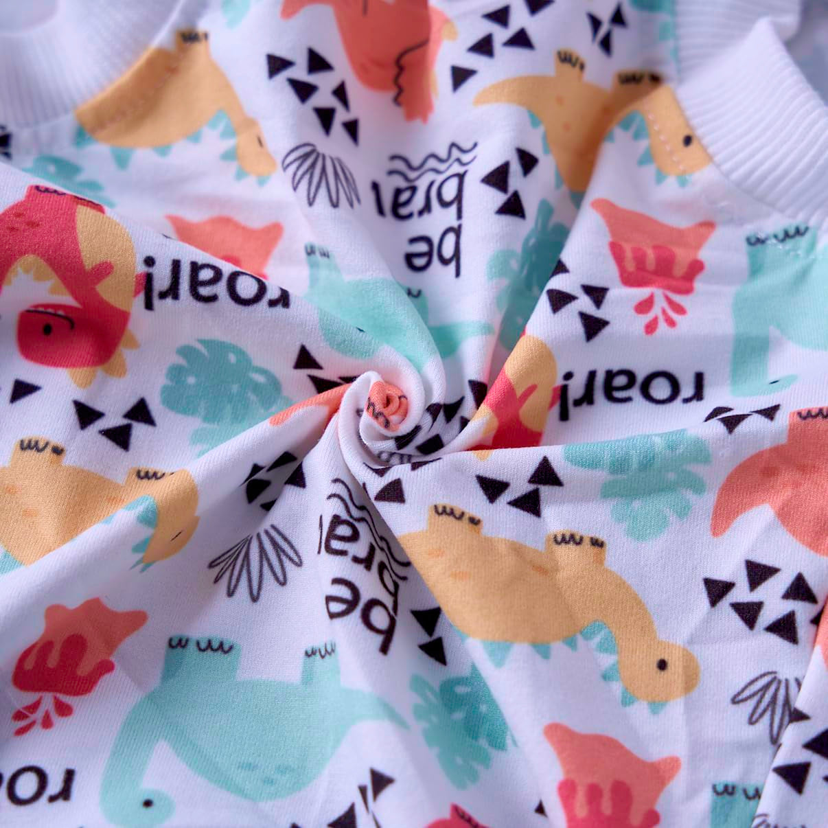 PetWarm dinosaur-pattern detail close-up highlights cute style with functional protection.