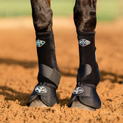 Professional's Choice ballistic hoof overreach boot pair mid black side view demonstrates secure fit during training.