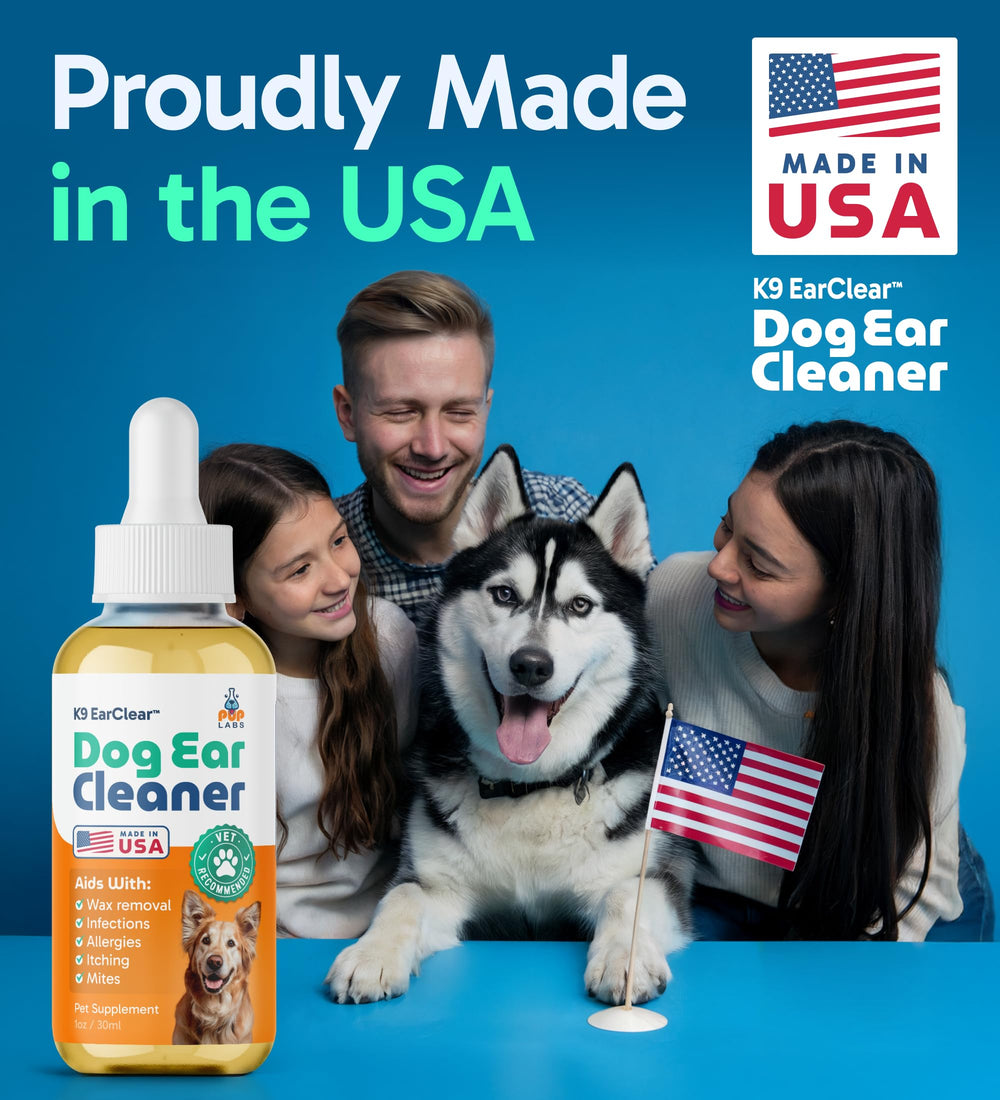 Pup Labs Ear Clear in-use dropper applying solution to a dog's ear.