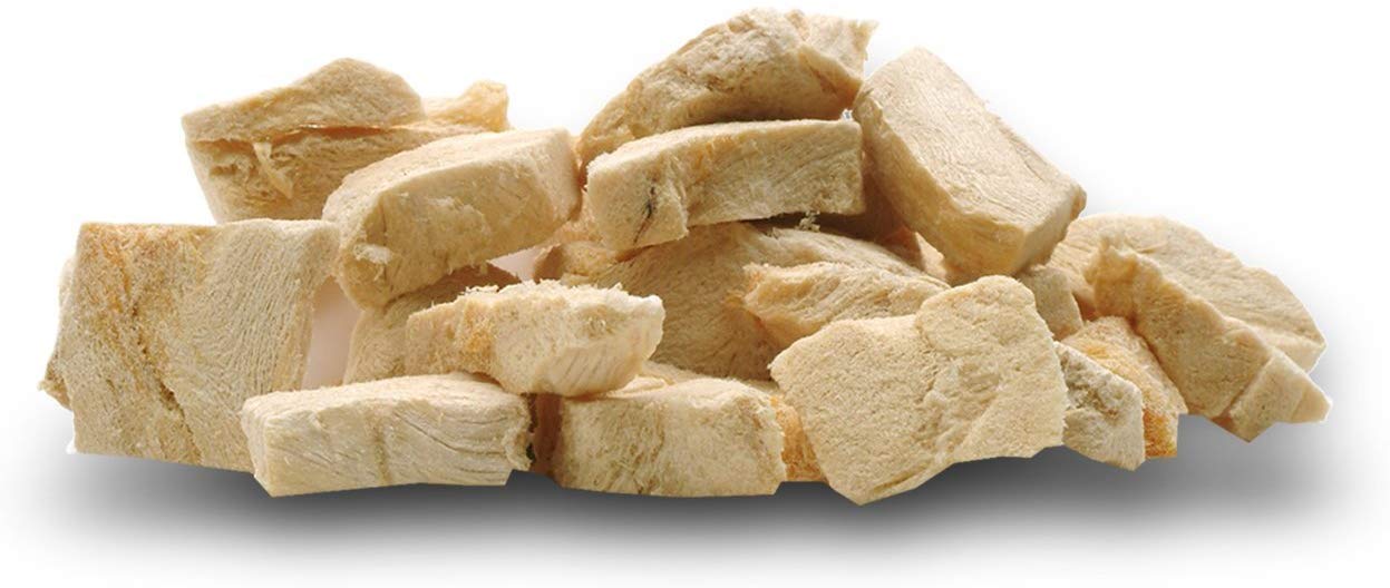 PureBites chicken breast treats offered during a calm dog reward moment.