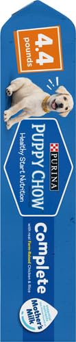 Purina Puppy Chow on floor during play promotes healthy activity.