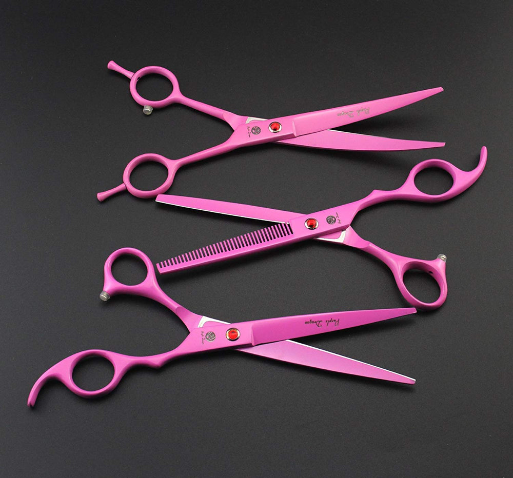 Purple Dragon pink pet grooming scissors in use for cats and dogs.