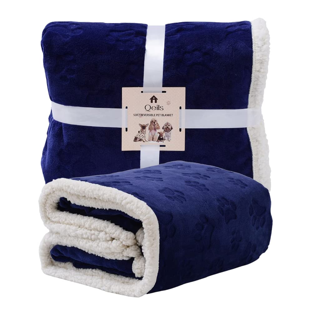 Qeils navy blue paw-prints blanket keeps furniture safe from shedding.