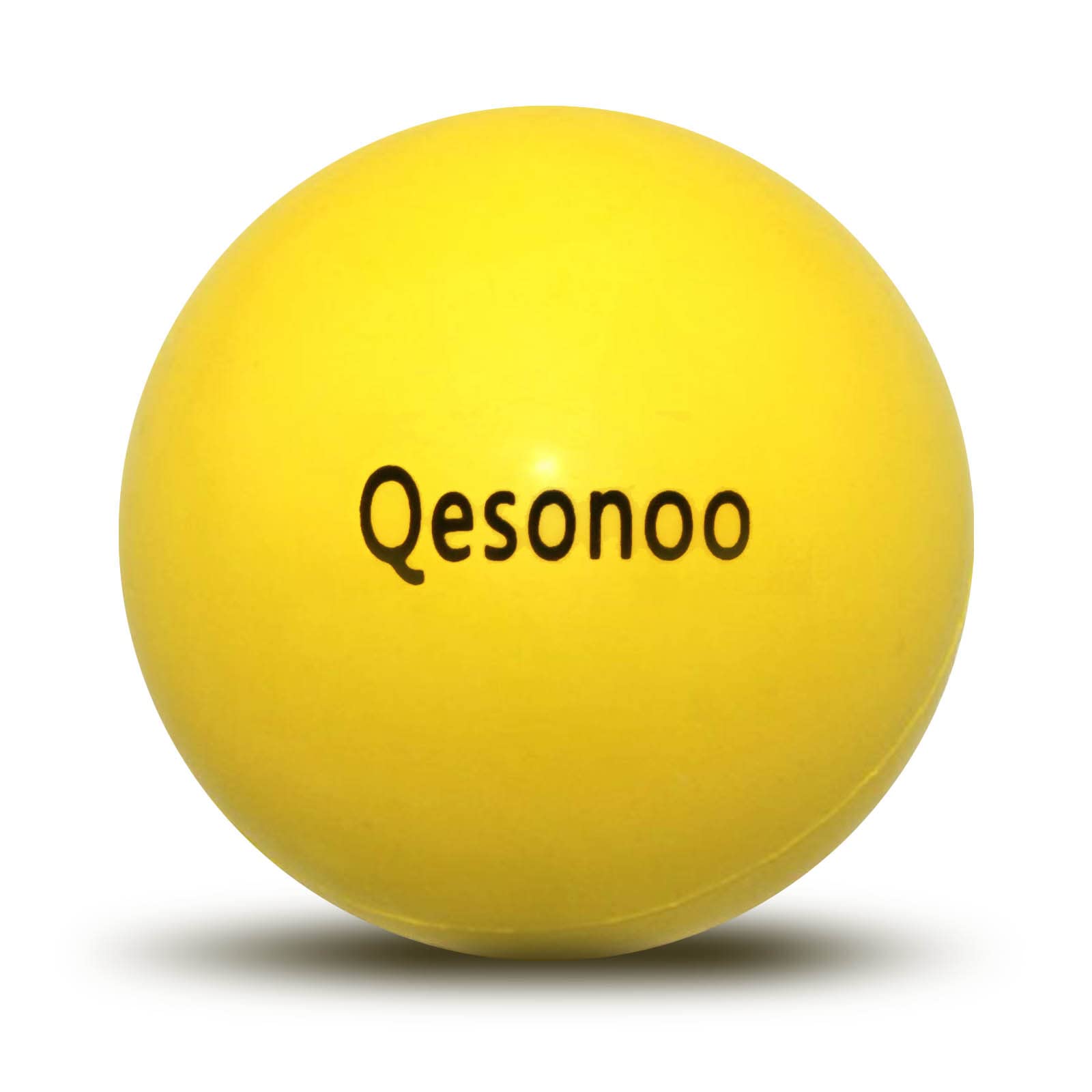 Qesonoo dog ball indestructible yellow close-up shows tough rubber for tough chewers