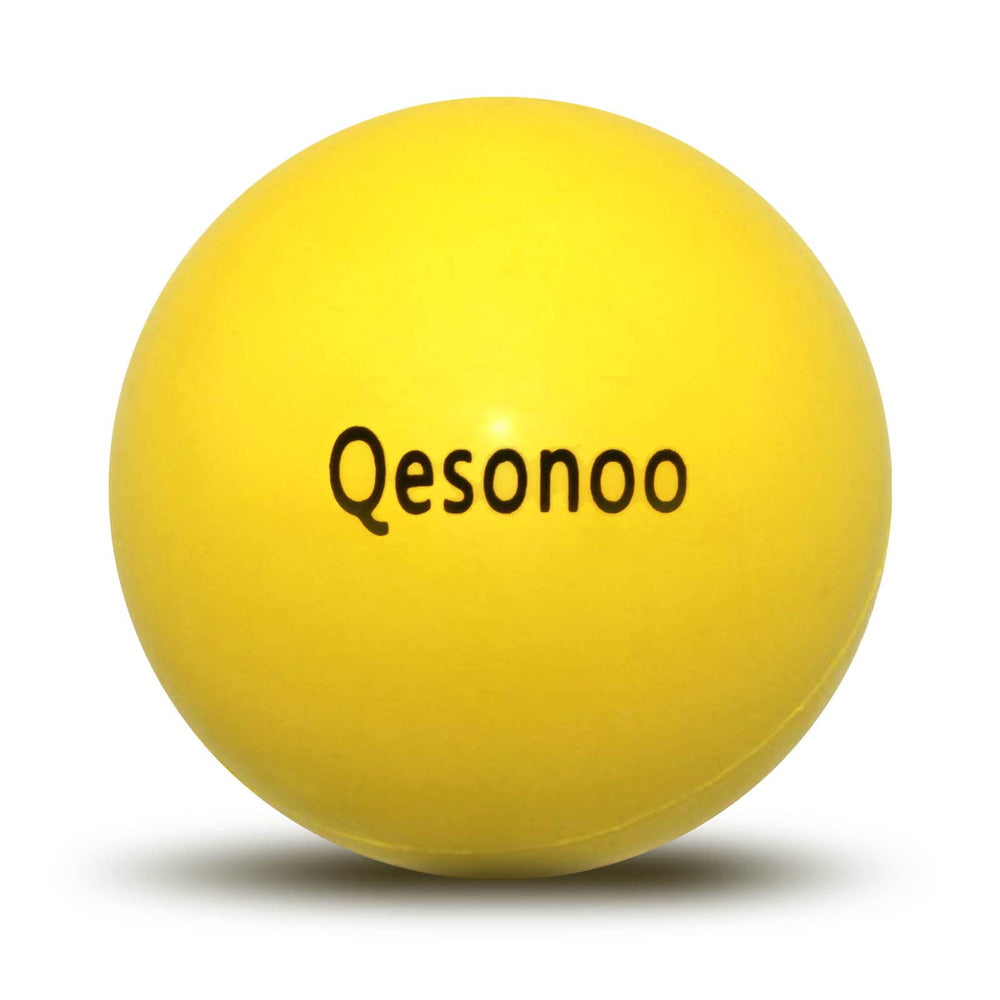 Qesonoo dog ball indestructible yellow close-up shows tough rubber for tough chewers