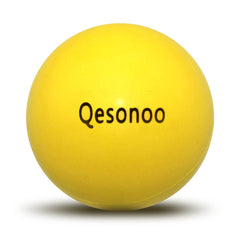 Qesonoo dog ball indestructible yellow close-up shows tough rubber for tough chewers