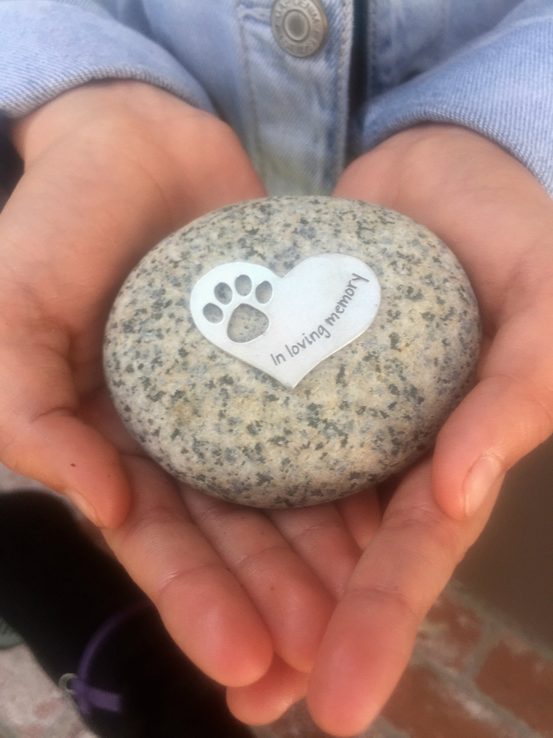 Quotable Cuffs river rock memorial showcases handcrafted stone display suitable for shelves or garden.