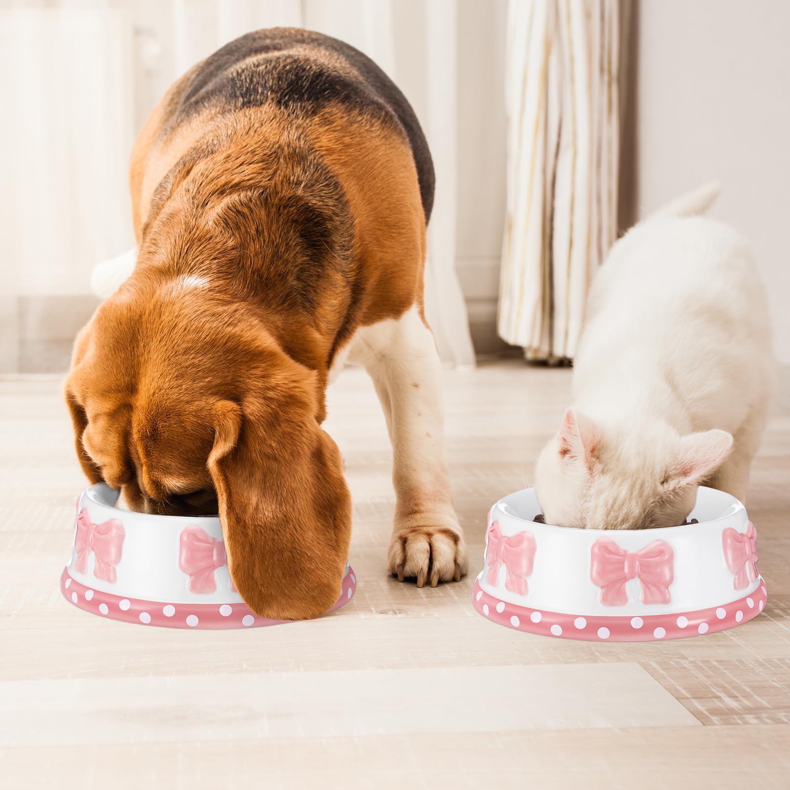 Reallnaive pink bow ceramic pet bowl in use with water or food.