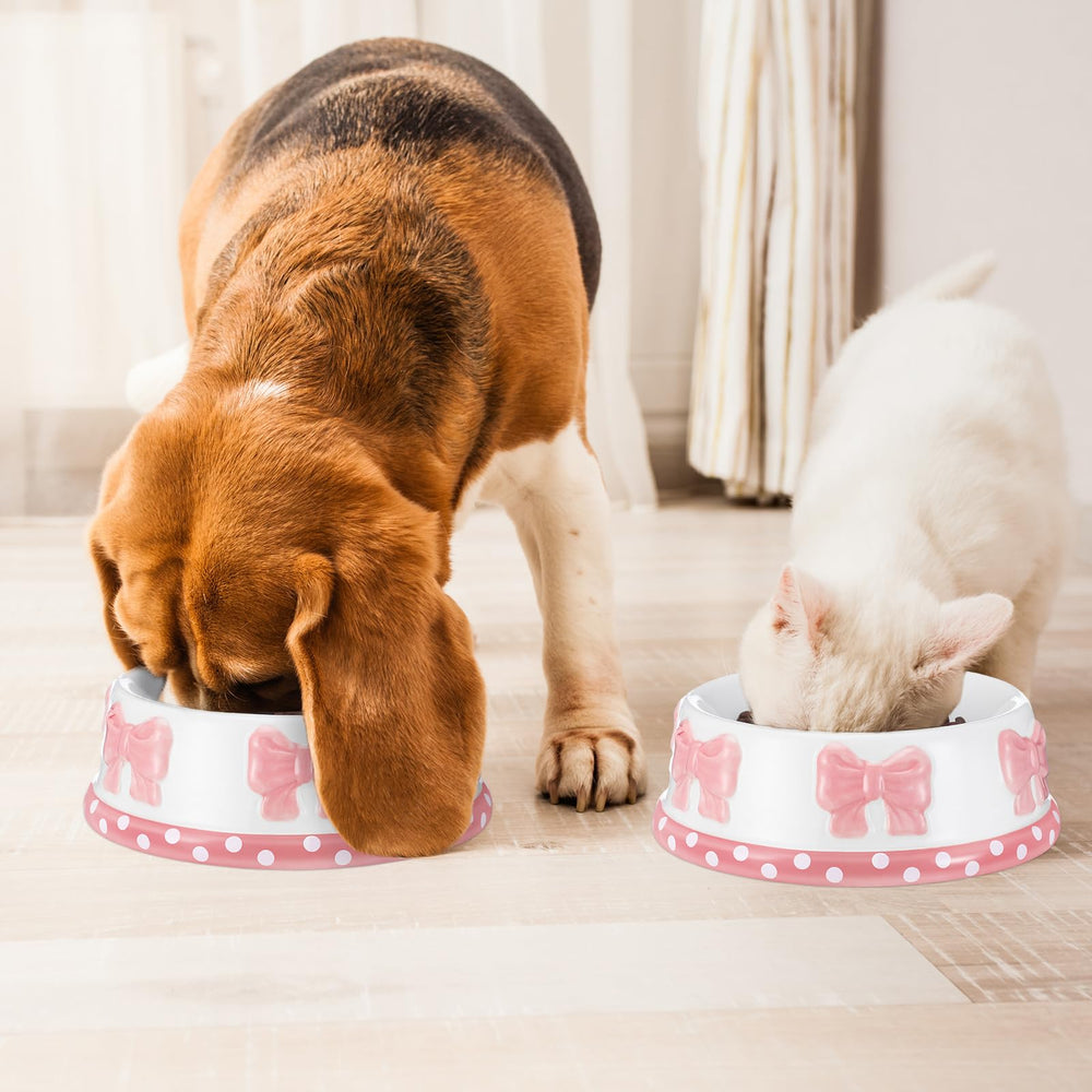 Reallnaive pink bow ceramic pet bowl in use with water or food.