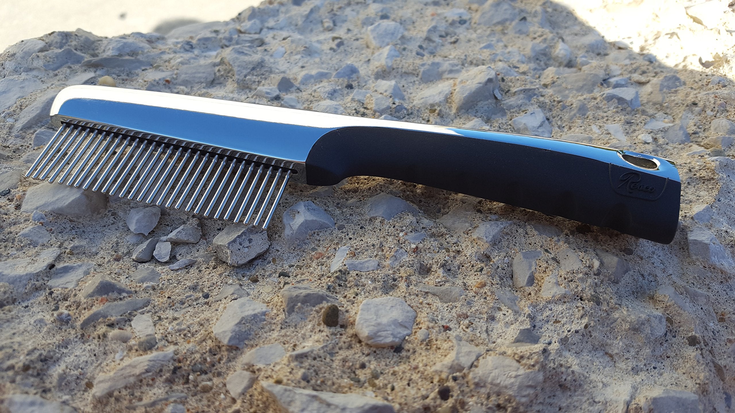 Close-up of 360-degree rotating pins for knot removal on the Resco comb