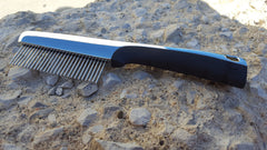 Close-up of 360-degree rotating pins for knot removal on the Resco comb