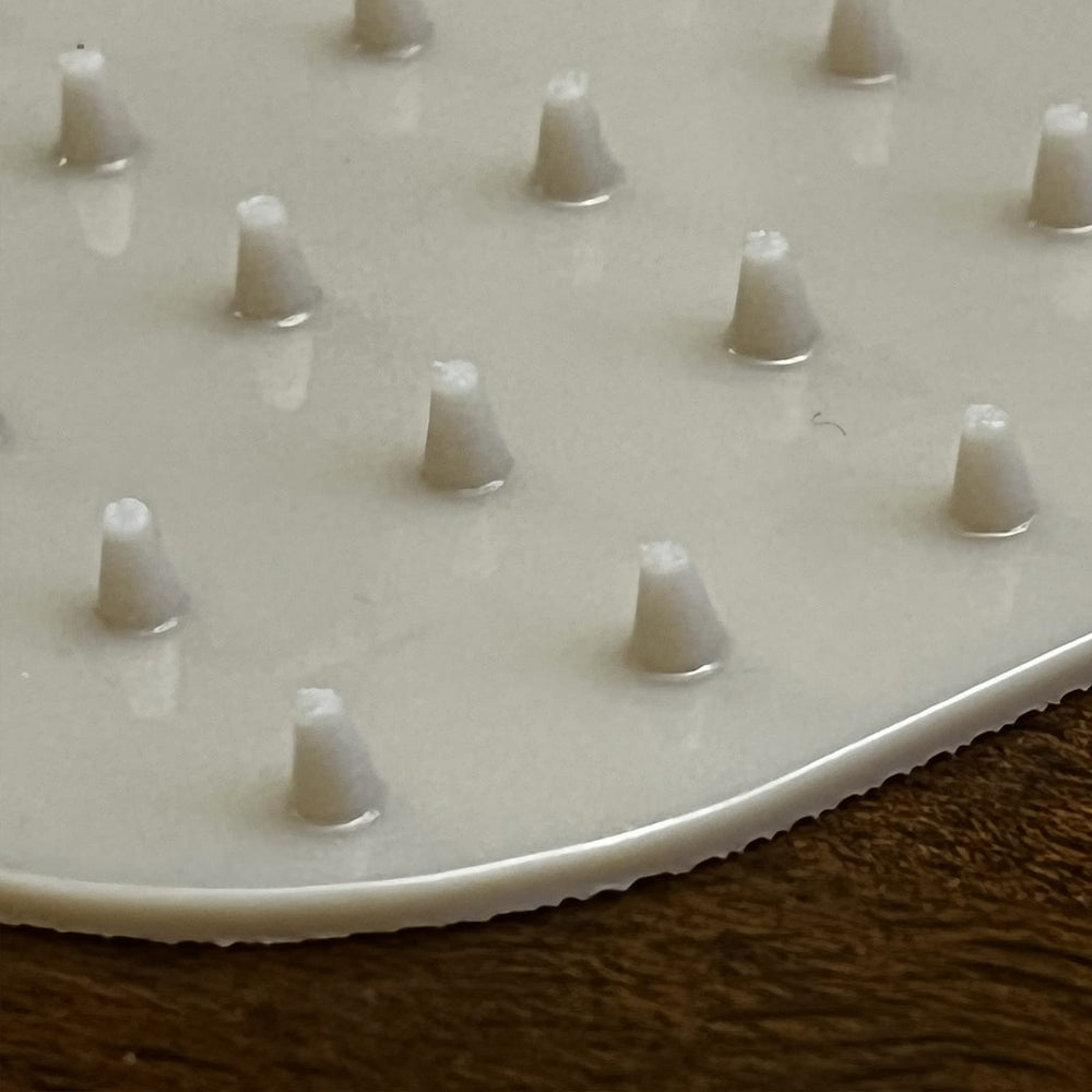 RESILIA training mat for pets beige demonstrates a non-electrical way to train behavior.