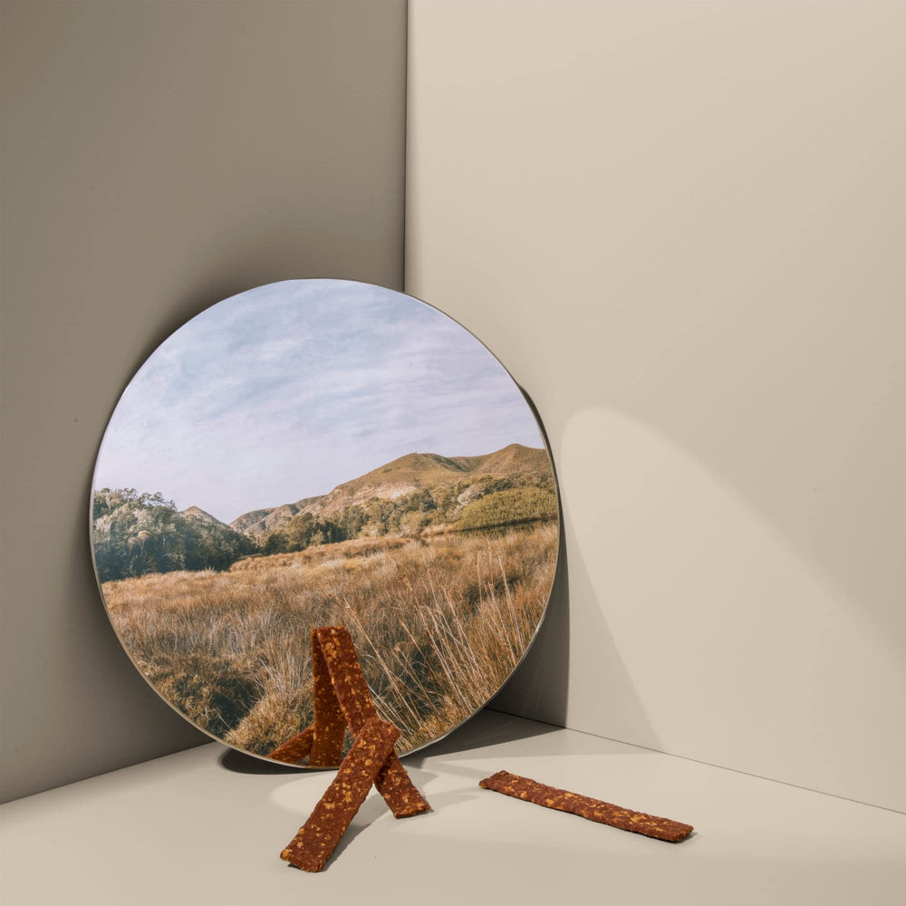 ROAM Ossy Jerky Ostrich Treats serving-size illustration suggesting portion control.