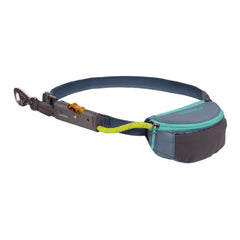 Ruffwear Hitch Hiker worn at the waist for hands-free hiking on rugged terrain.