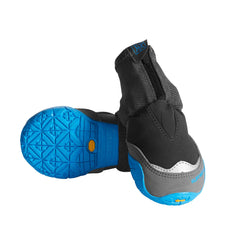 Ruffwear Polar Trex dog boots on a paw, delivering warmth and secure fit for cold hikes.