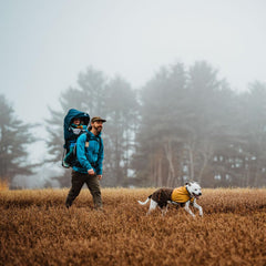 Ruffwear Sun Shower leg loops shown keeping jacket in place during windy walks.