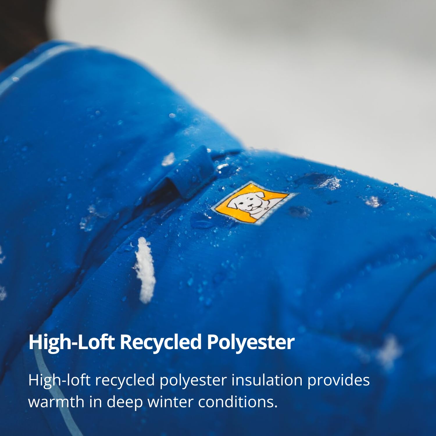 Ruffwear Vert Dog Winter Jacket leg loops provide anchor in gusty conditions and maintains coverage.