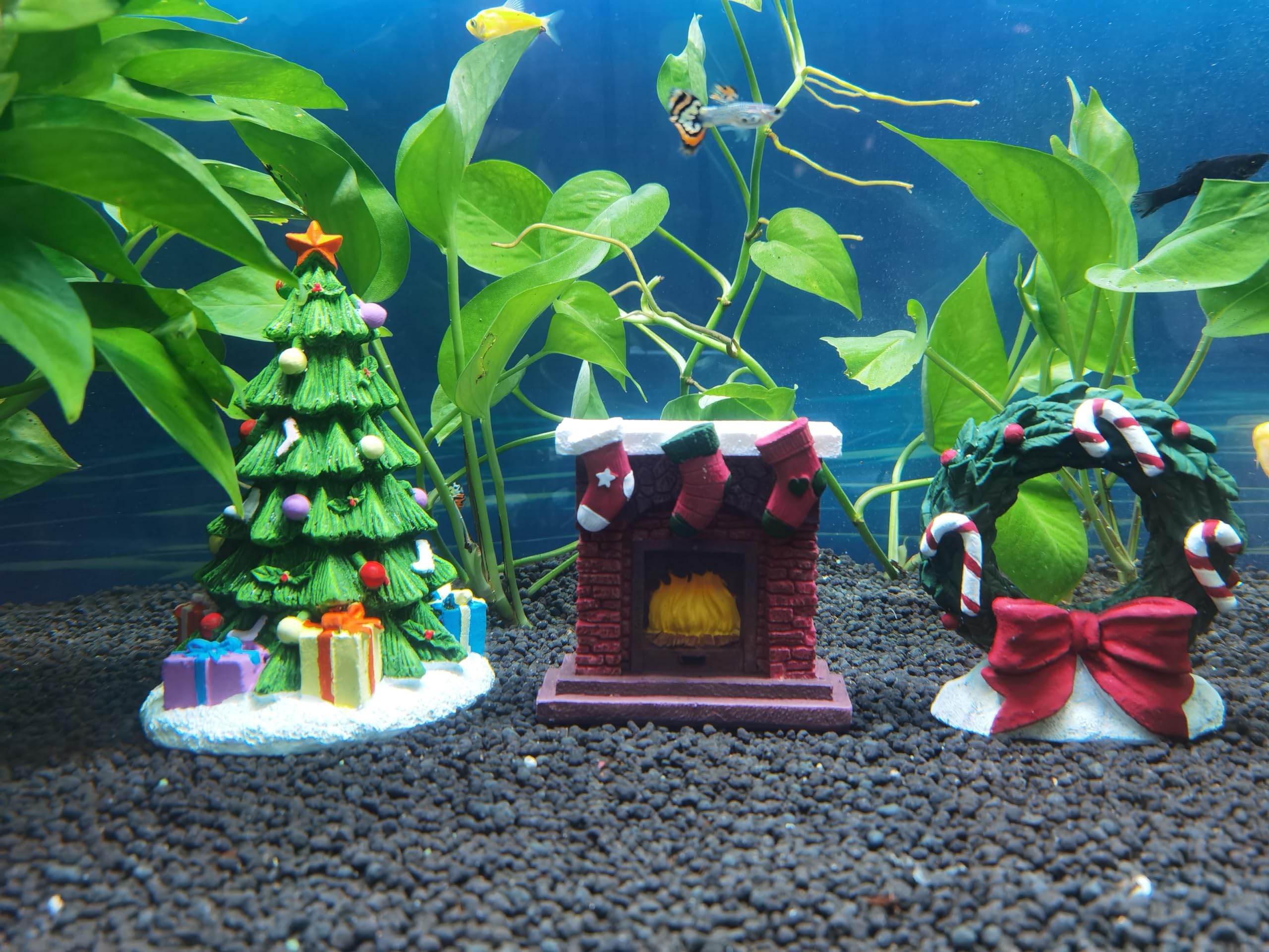RVQIGYP aquarium Christmas fireplace ornament closeup highlights warm, welcoming tones