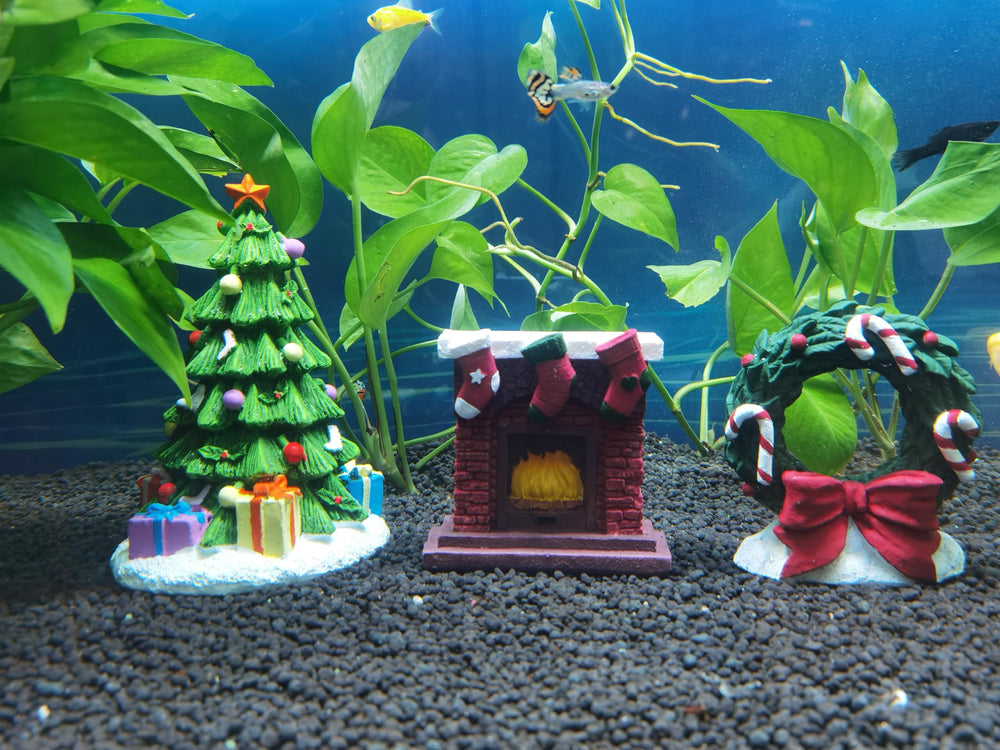 RVQIGYP aquarium Christmas fireplace ornament closeup highlights warm, welcoming tones