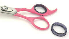 Scaredy Cut pink seven-comb attachments offer versatile length control during styling