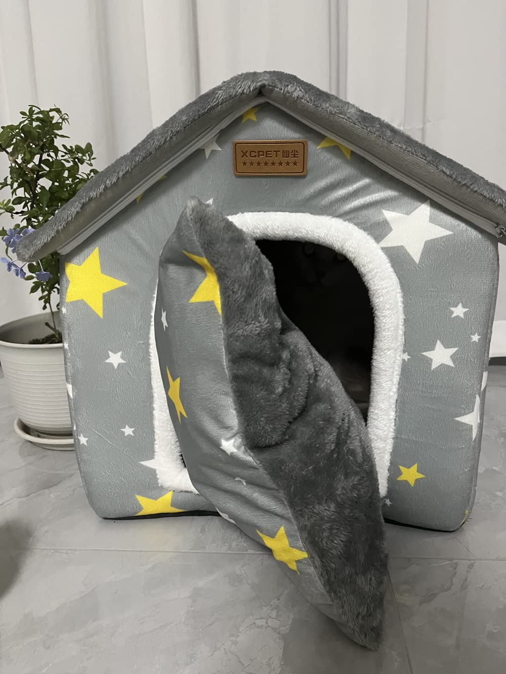 SEAHOME dog house grey folded design highlights portable, easy to store shelter.