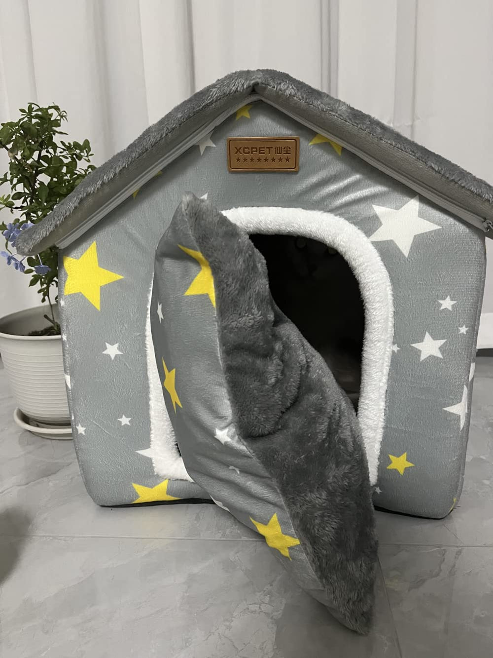 SEAHOME dog house grey folded design highlights portable, easy to store shelter.